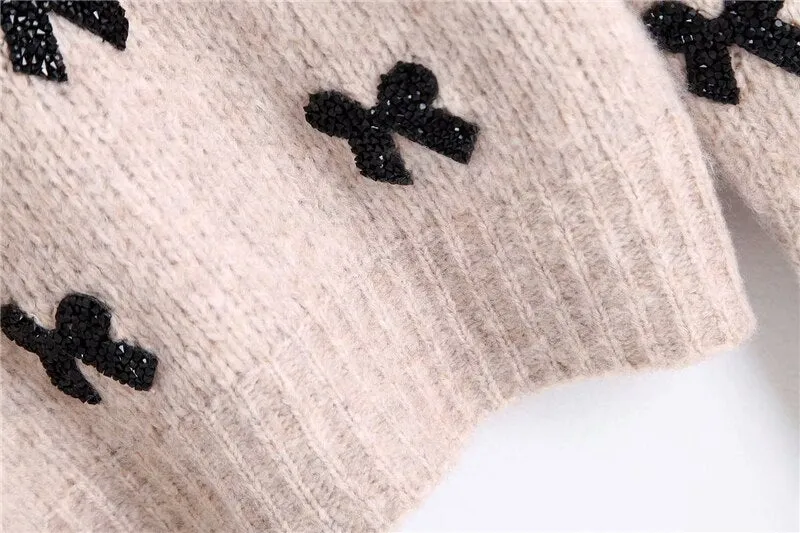 SWEATER WITH BOWS
