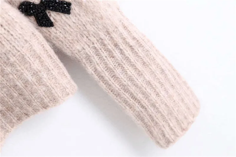 SWEATER WITH BOWS